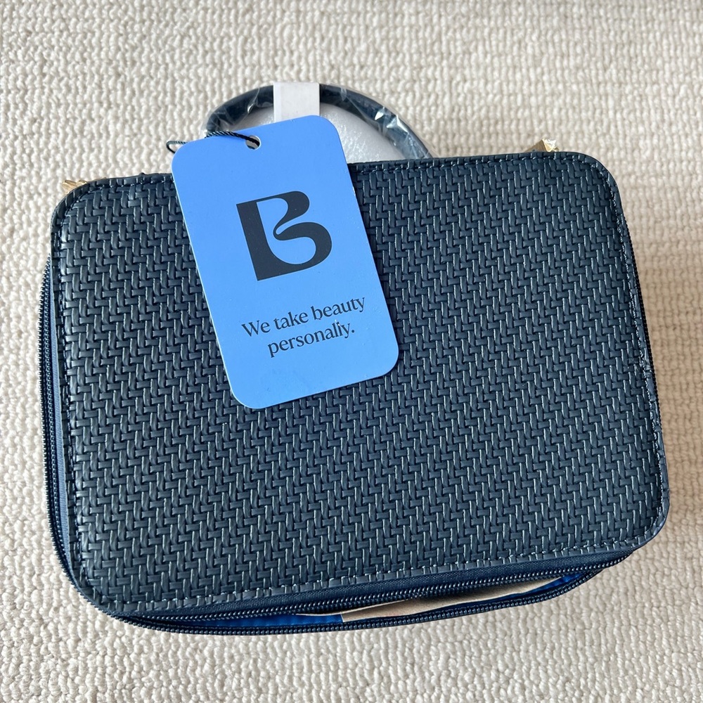 Blue Cosmetic Bag with Textured Design and Zipper Closure